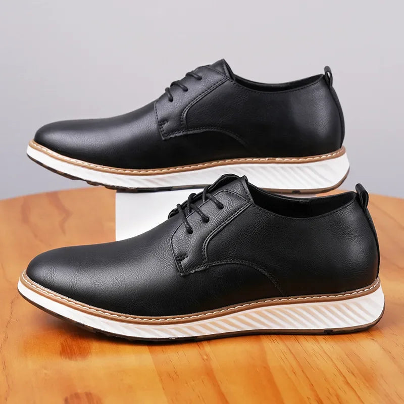 Black Torino Leather Orthopedic Sneakers with white chunky sole and lace-up closure, shown in pair display