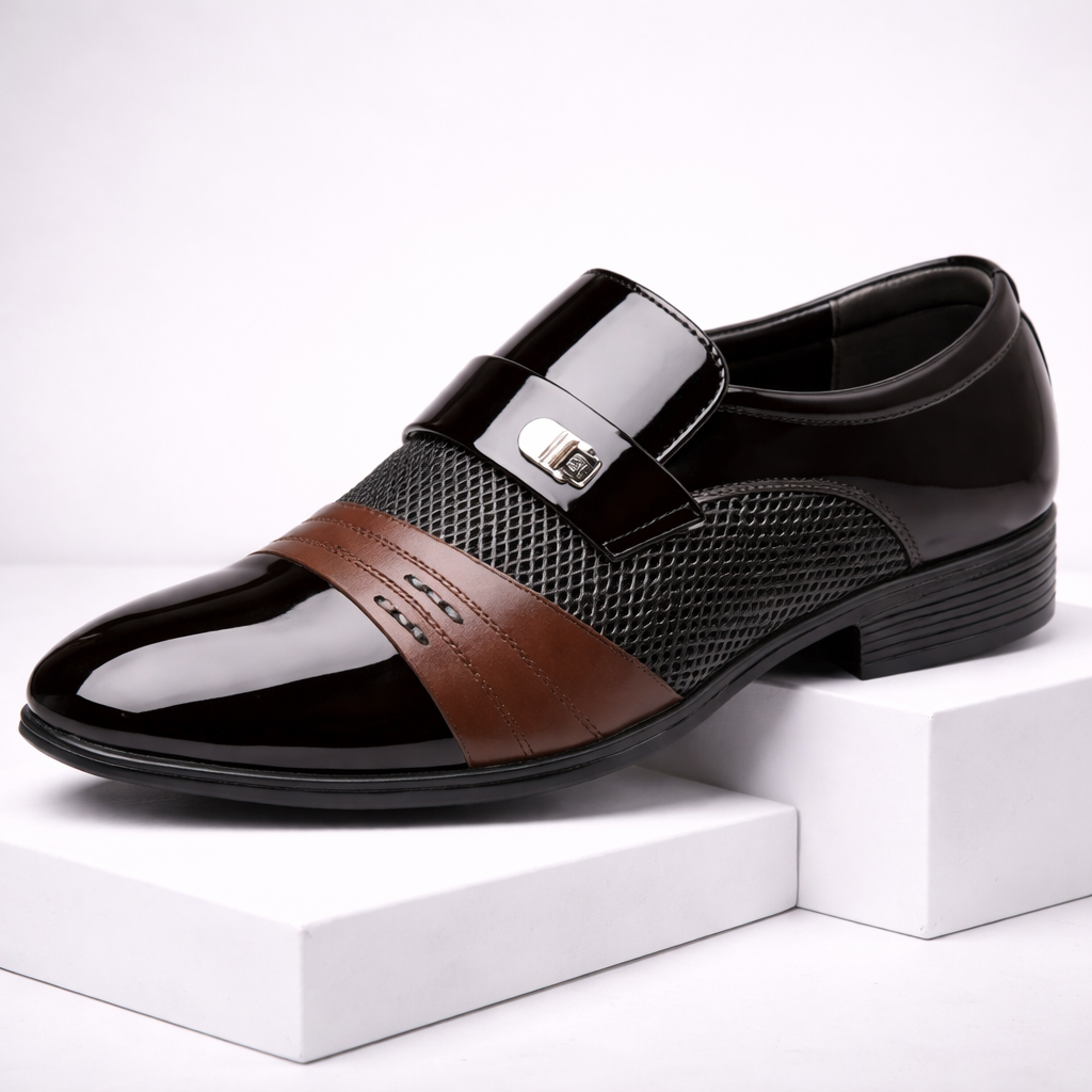 Torreno men's black patent leather slip-on loafers with brown accent stripe and silver metal buckle detail on white display block