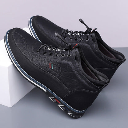 Black Torven leather mid-top men's sneakers with lace-up closure, colorful stripe detail, and blue-accented sole.