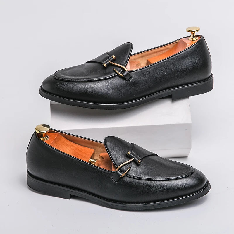 Black leather men's slip-on loafers with gold metal buckle detail and orange interior lining