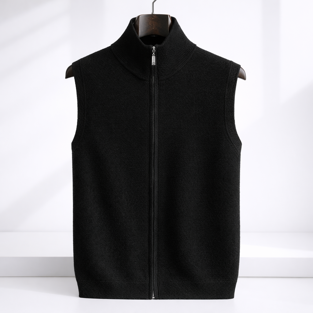 Black merino wool men's zip-up sweater vest with mock neck collar and silver zipper, displayed on wooden hanger