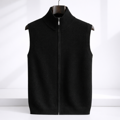 Black merino wool men's zip-up sweater vest with mock neck collar and silver zipper, displayed on wooden hanger