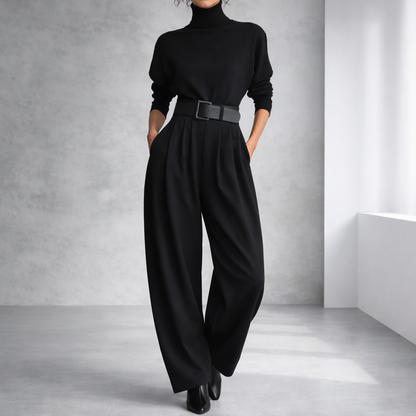 Women's black turtleneck sweater and wide-leg pleated pants set with leather belt and block heels