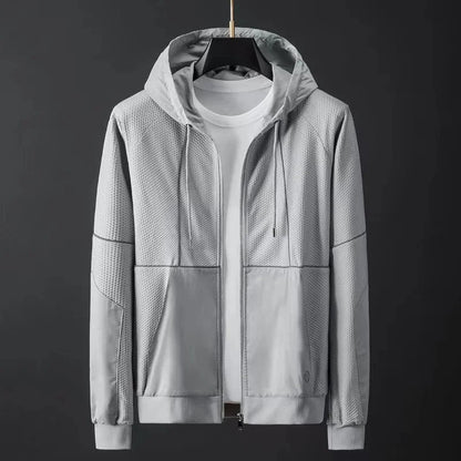 Light gray men's hooded zip-up jacket with textured mesh panels, drawstring hood, front pockets, and ribbed cuffs