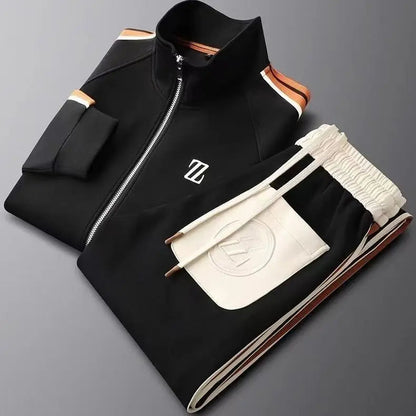 Black men's zip-up track jacket and jogger pants set with orange stripe accents and white leather trim details.