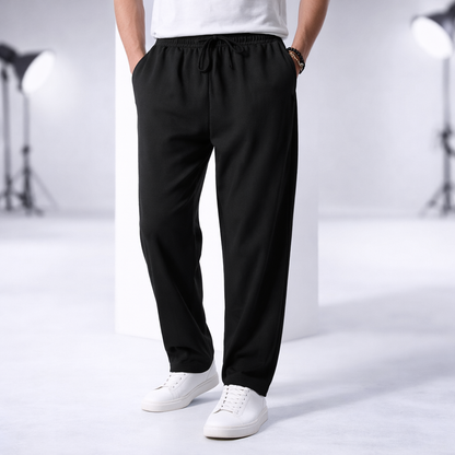 Black cotton drawstring pants for men with elastic waist and pockets, casual loose fit trousers
