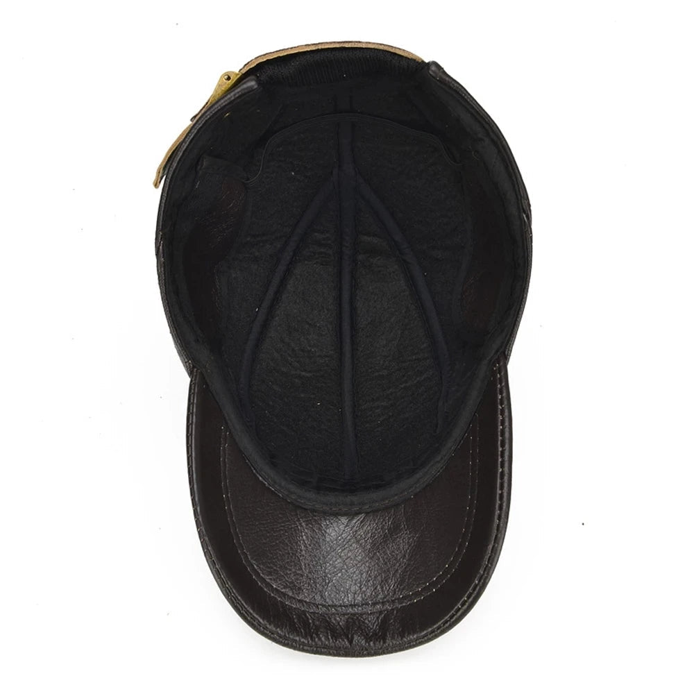 Interior view of dark brown leather baseball cap showing black lining, panel seams, and adjustable brass buckle strap.