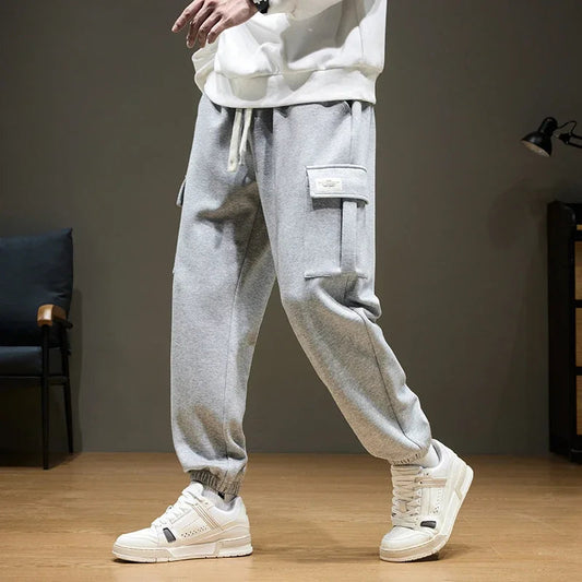 Men's gray cargo joggers with drawstring waist and utility pocket, relaxed fit sweatpants for casual wear