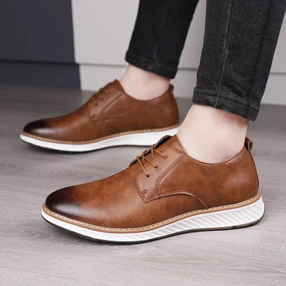 Brown Torino Leather Orthopedic Sneakers with white sole and lace-up closure, worn with dark jeans