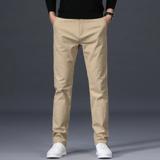Men's slim-fit beige cotton dress pants with straight leg, business casual chinos on gray background