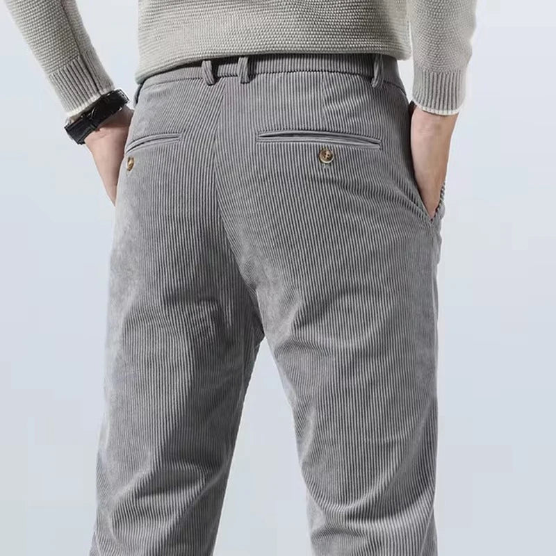 Gray corduroy slim fit chino pants for men back view showing vertical ribbed texture and pockets