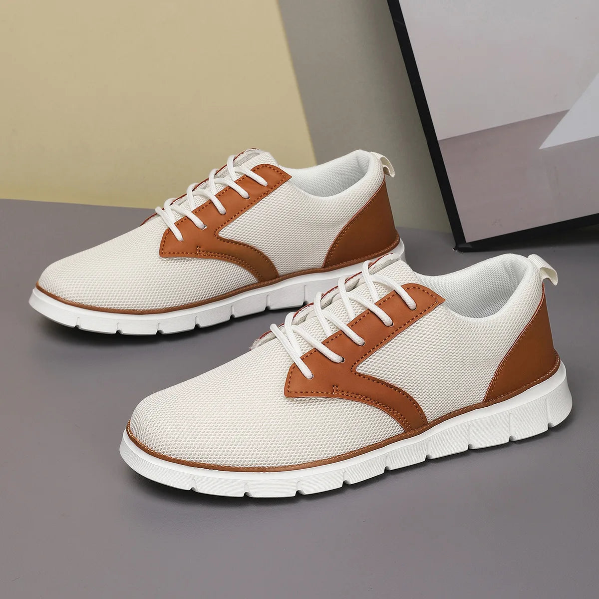 Womens beige canvas sneakers with tan leather trim and white laces on athletic sole for orthopedic support