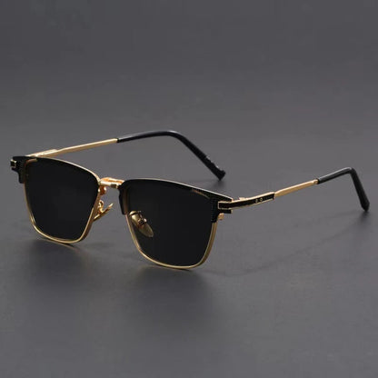 Men's metal frame polarized sunglasses with gold trim, black lenses, and black temple tips on gray background.