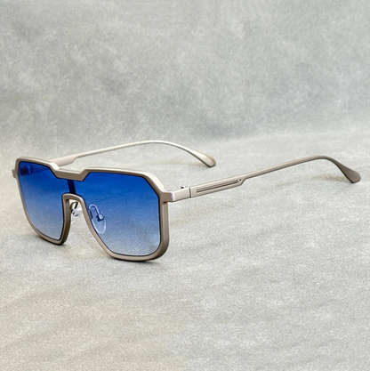 Silver frame square aviator sunglasses with blue gradient lenses for men on gray background