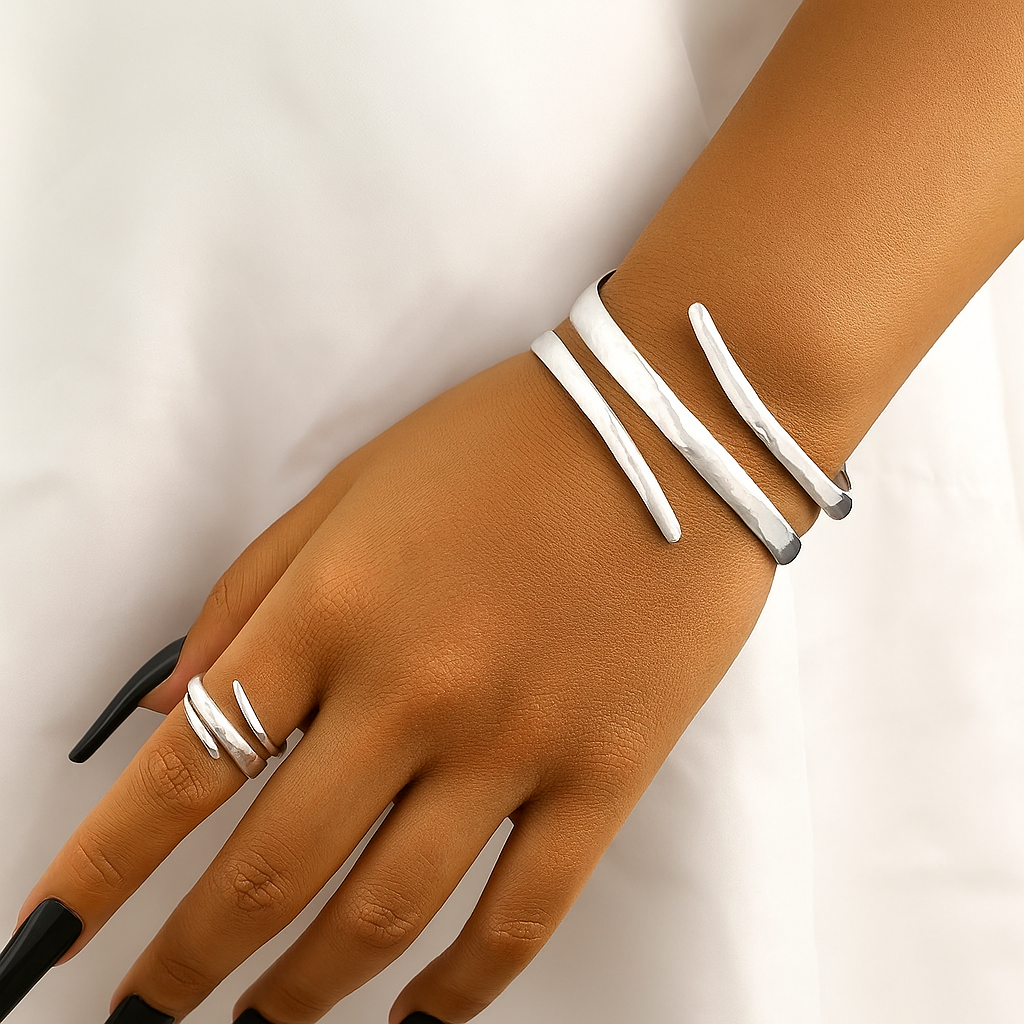 Silver hammered spiral wrap cuff bracelet and matching open ring set worn on a woman's wrist and finger