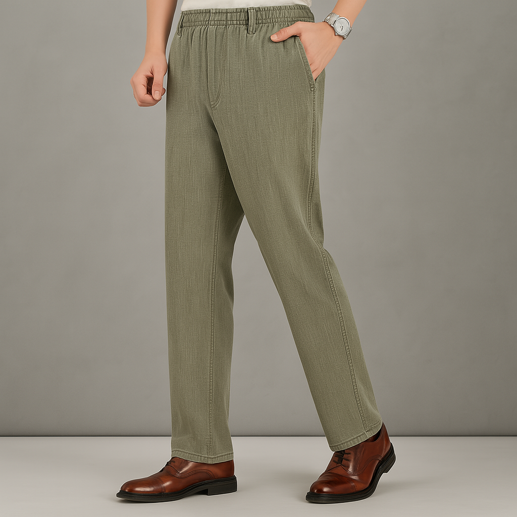 Men's olive green linen drawstring pants with straight leg fit, side pockets, worn with brown leather dress shoes.