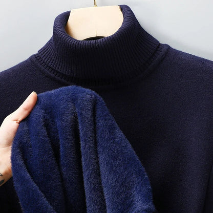 Navy blue men's merino wool turtleneck sweater on mannequin, hand showing soft fleece inner lining detail
