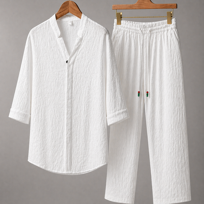 White textured cotton linen men's shirt and pants set with red rose embroidery detail on wooden hangers