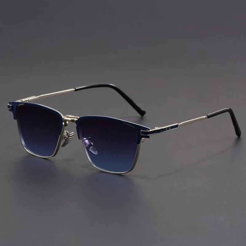 Men's metal frame polarized sunglasses with blue gradient lenses, silver browline frame, and black temple tips on gray background.