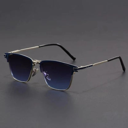 Men's metal frame polarized sunglasses with blue gradient lenses, silver browline frame, and black temple tips on gray background.