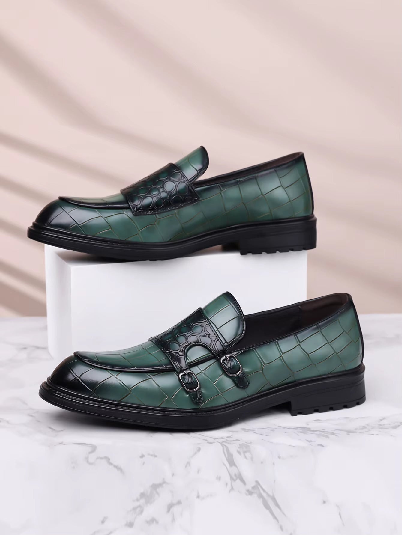 Green croc-embossed leather double monk strap loafers with black sole and toe cap detail for men