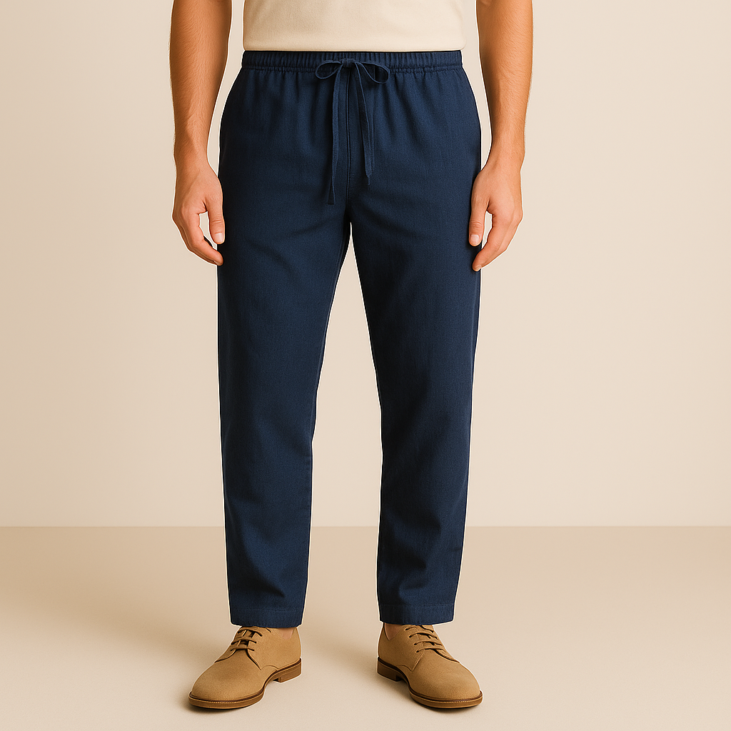 Navy blue linen-cotton drawstring pants for men with elastic waistband and relaxed fit on beige background