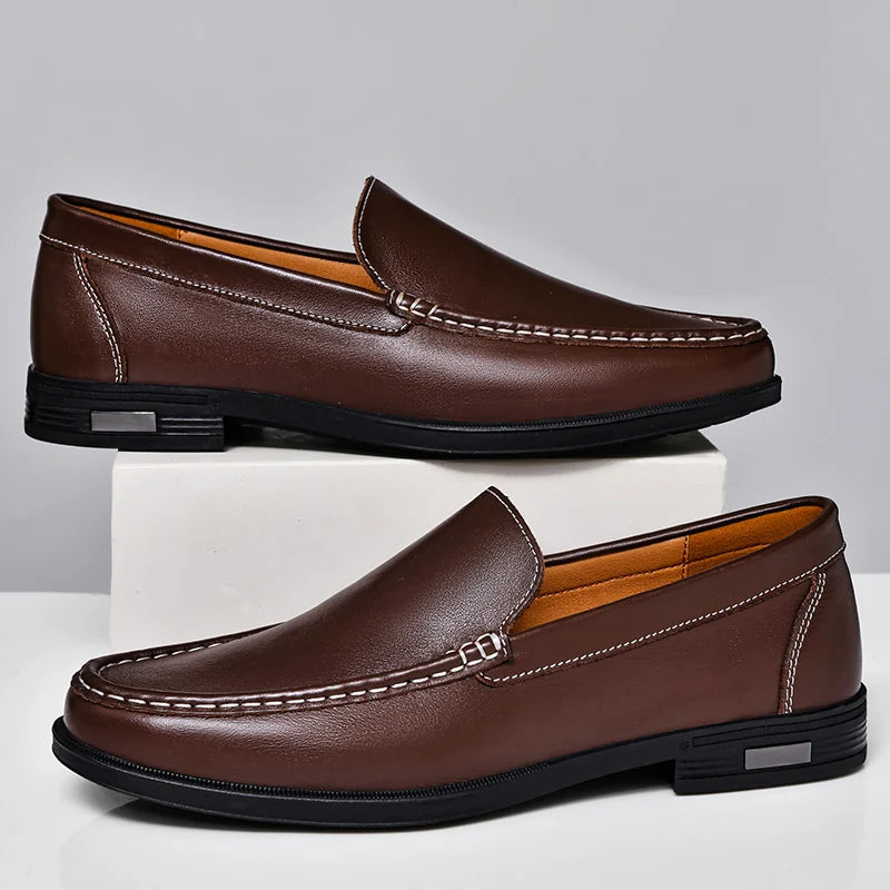 Brown leather men's slip-on loafers with white contrast stitching and black rubber sole