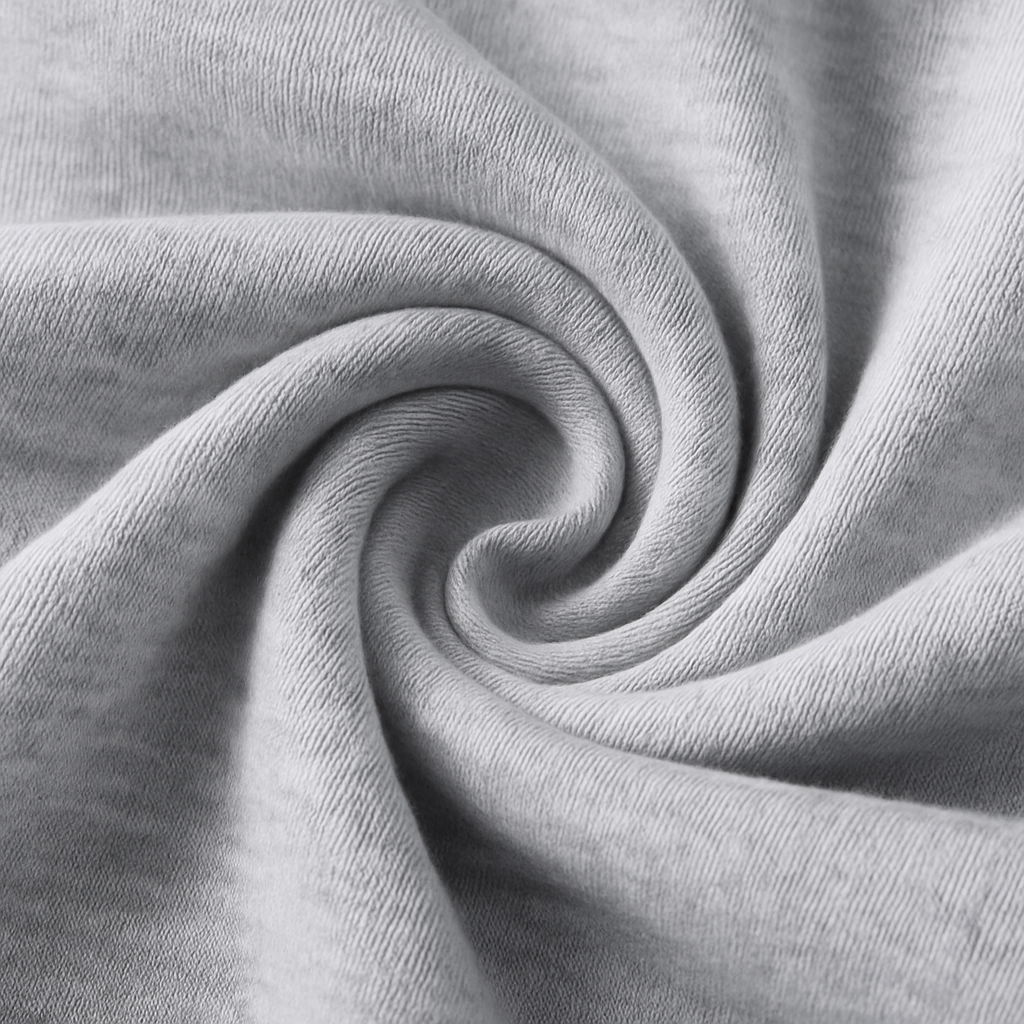 Close-up of soft gray heathered cotton fabric twisted in a spiral, showcasing the texture of Vex Men's Sweatpants.