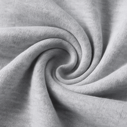 Close-up of soft gray heathered cotton fabric twisted in a spiral, showcasing the texture of Vex Men's Sweatpants.