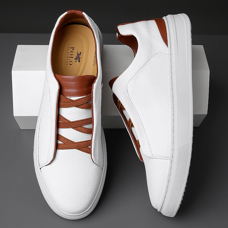 White leather men's slip-on sneakers with brown contrast laces and trim, displayed on white box, top and side views.