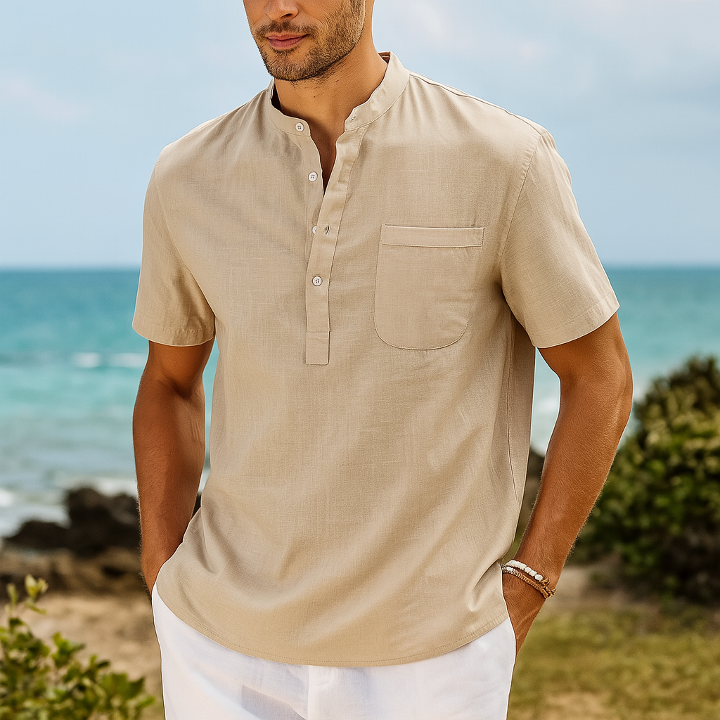 Men's beige linen band collar henley shirt with short sleeves and chest pocket on beach background