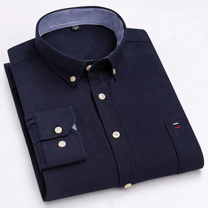 Navy blue men's long-sleeve cotton button-down shirt with striped collar lining, chest pocket, and gold buttons, folded flat.