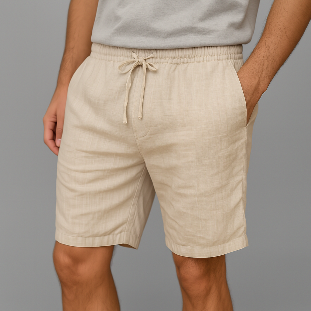 Men's beige linen drawstring shorts with elastic waistband and side pockets on gray background
