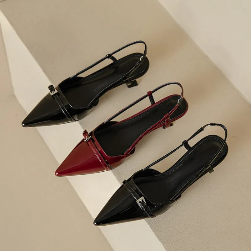 Three women's pointed-toe slingback block heel pumps in black, burgundy-black, and all-black patent leather with buckle detail.