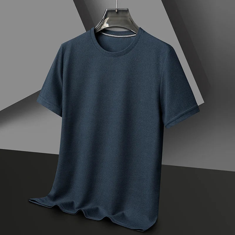 Navy blue men's waffle knit crewneck t-shirt with short sleeves displayed on hanger against gray background