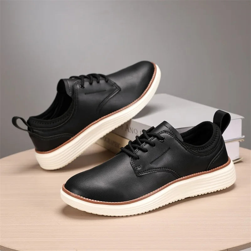 Black leather lace-up casual men's shoes with white platform sole and brown accent trim, displayed on wooden surface
