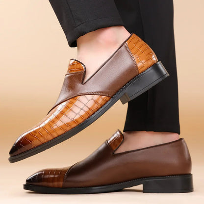 Men's leather slip-on loafers featuring two-tone brown croc-embossed pattern, worn with black dress pants
