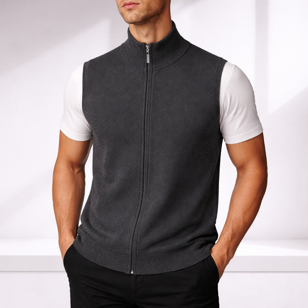 Dark gray merino wool zip-up vest worn by man with white t-shirt and black pants