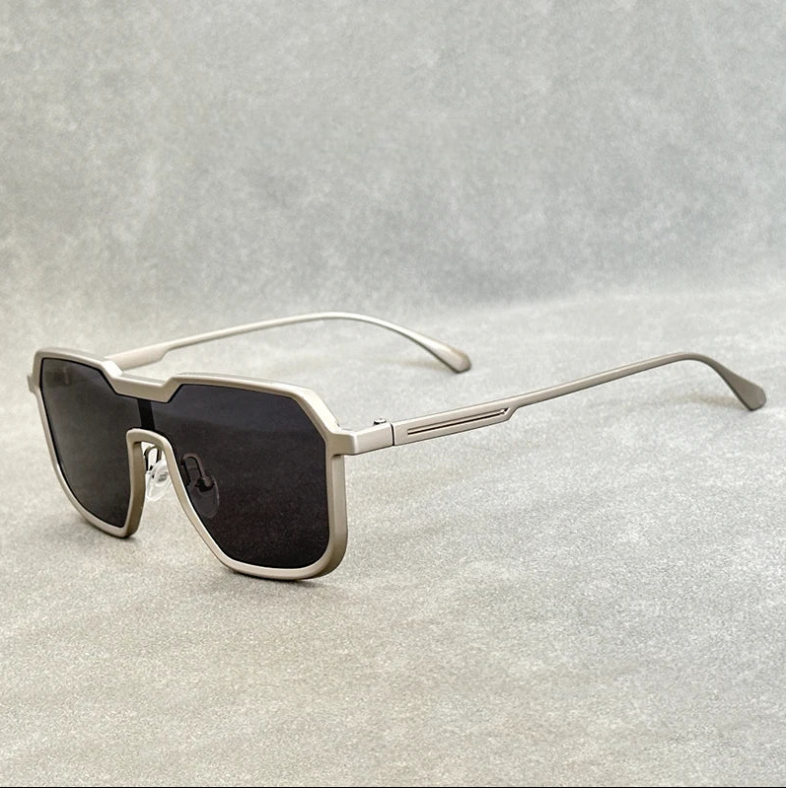 Silver square aviator sunglasses with dark gradient lenses and slim metal temples on a gray background