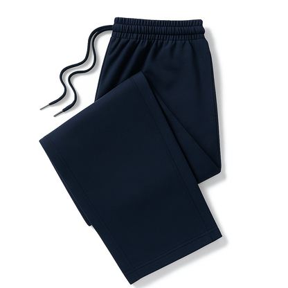Navy blue men's cotton drawstring joggers, folded flat, featuring elastic waistband and side pockets.