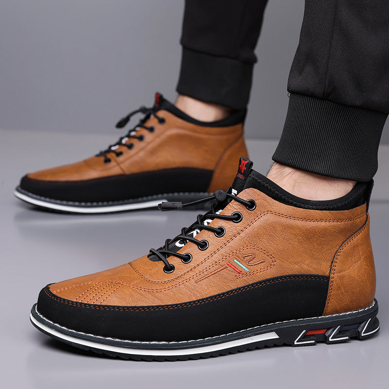 Brown and black men's Torven leather mid-top sneakers with black laces, contrast sole, and red accent details.