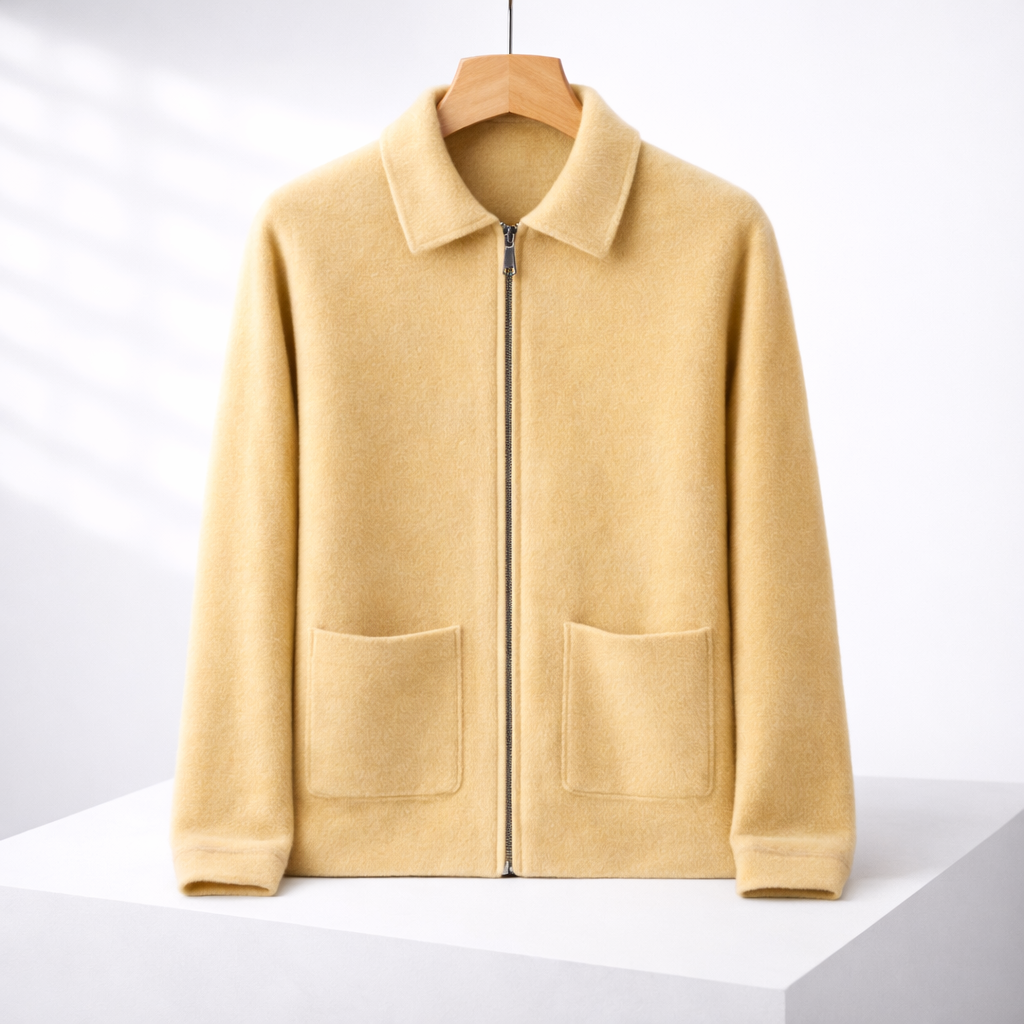 Men's light yellow cashmere zip-up sweater jacket with collar, two front patch pockets, displayed on wooden hanger.