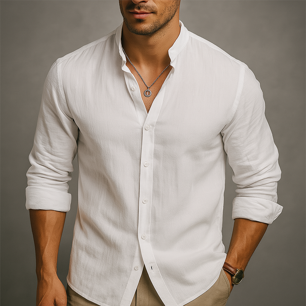 Men's white linen band collar button-up shirt, long sleeves, relaxed fit, styled with khaki pants and silver necklace.